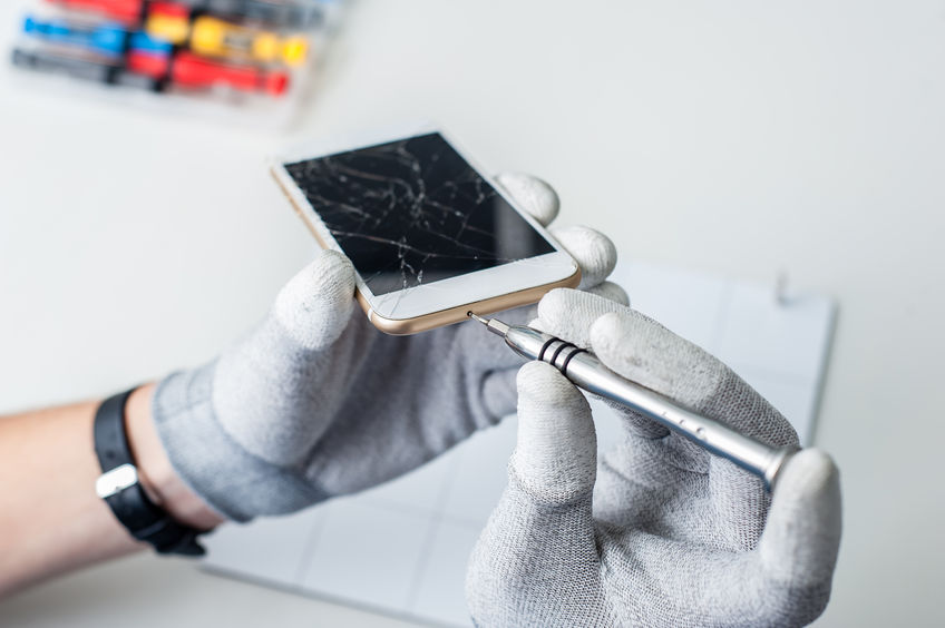 46987685 - close-up photos showing process of mobile phone repair